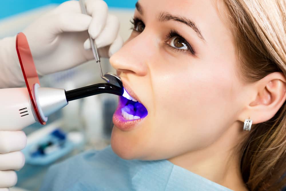 A patient receiving bonding work after straightening teeth. 