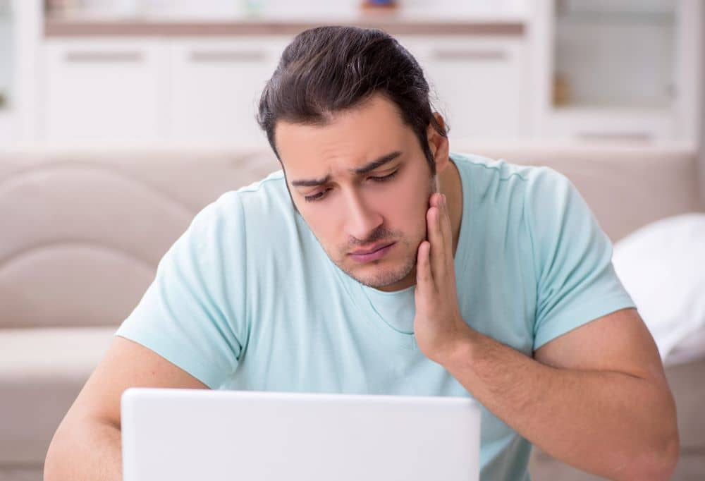 A young man with toothache.