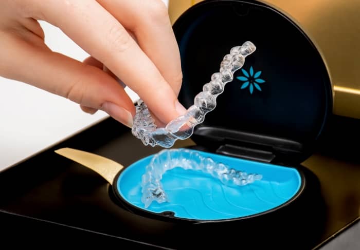 With clear aligners, you can remove them to clean your teeth and eat.