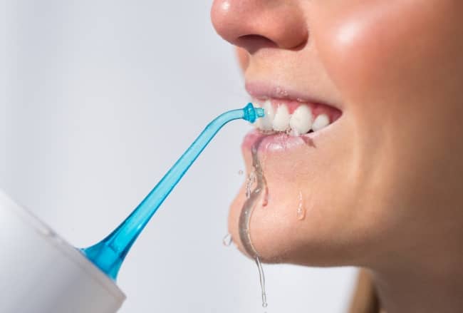 Water flossing removes food stuck between your teeth and the bacteria lingering there before it hardens into plaque.