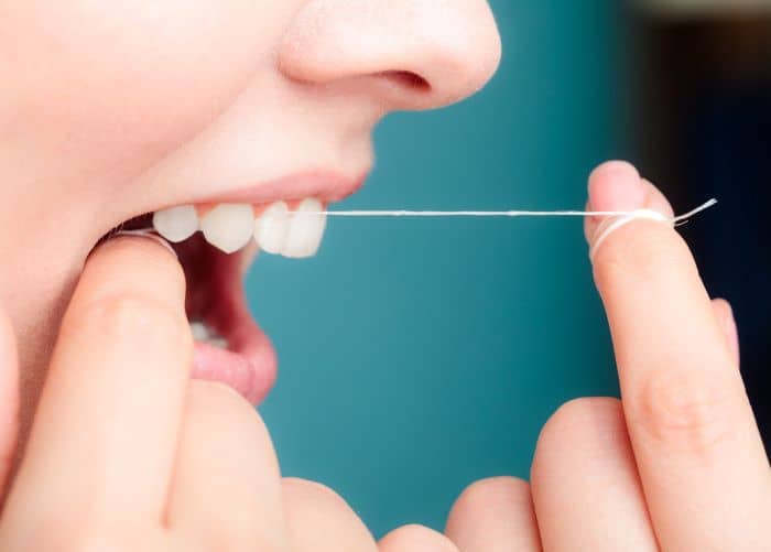 Floss at least once a day to help prevent cavities.