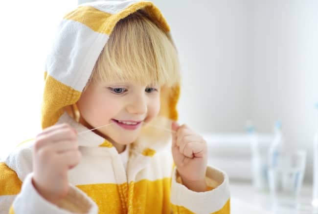 As soon as your baby has two teeth that touch, you can floss between them.