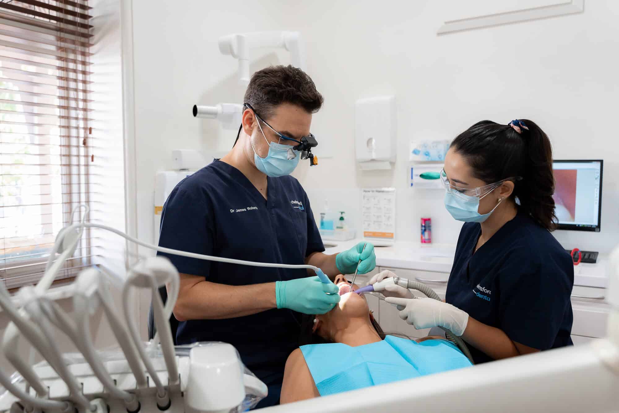 Dental professional performing teeth cleaning at a Mount Lawley clinic