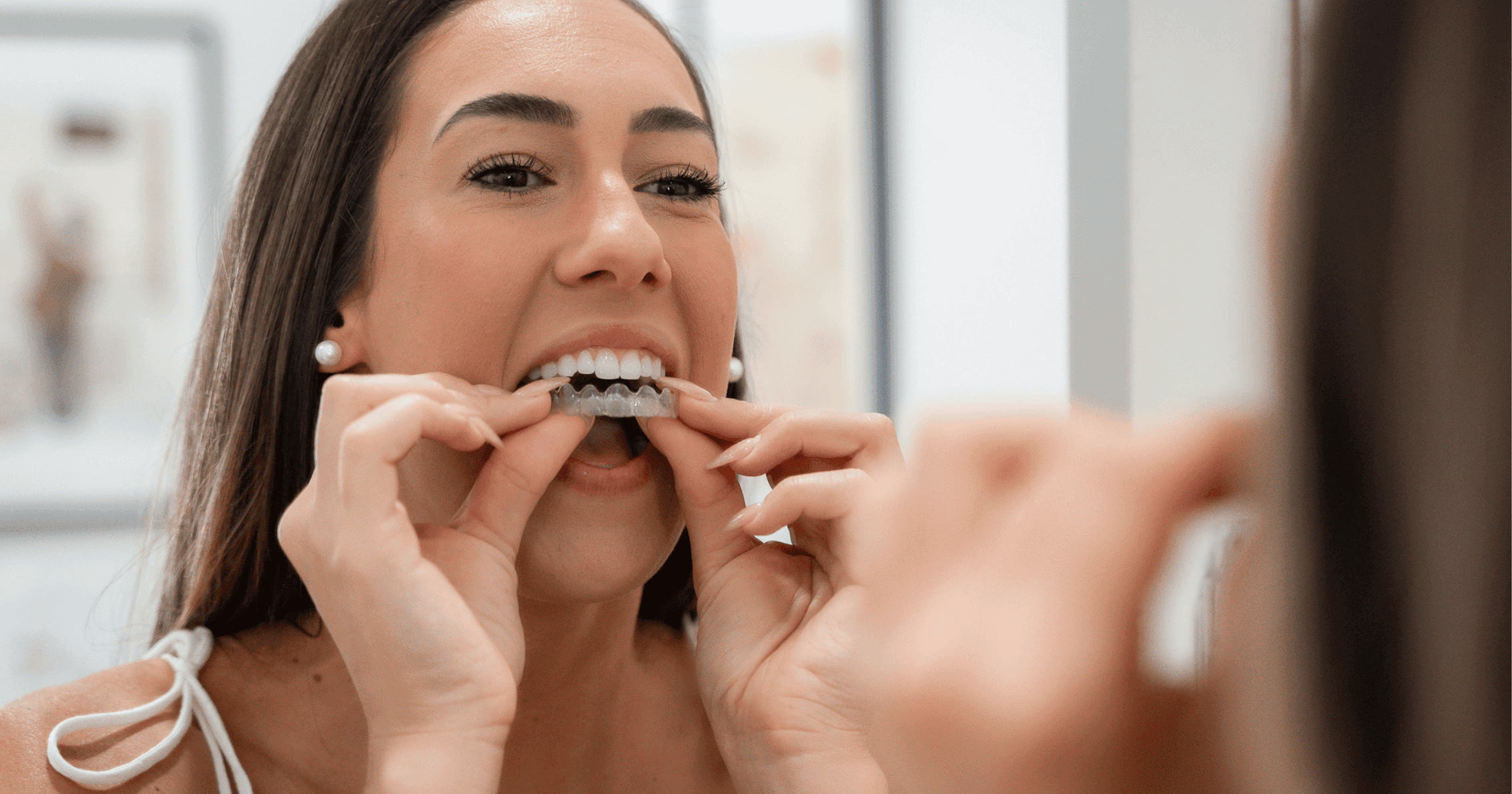 Patient trying on Invisalign clear aligners at Chelmsford Dental in Mount Lawley