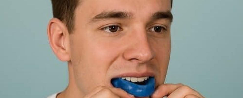 man putting in bite splint