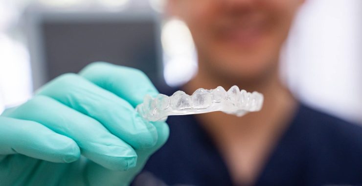 Dentist holding bite splint