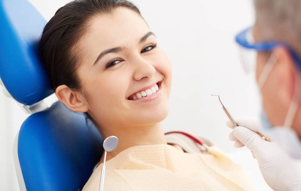 patient smiling, after dental consultation.