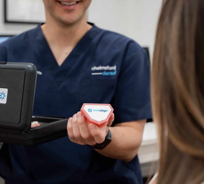 dentist holding invisalign container