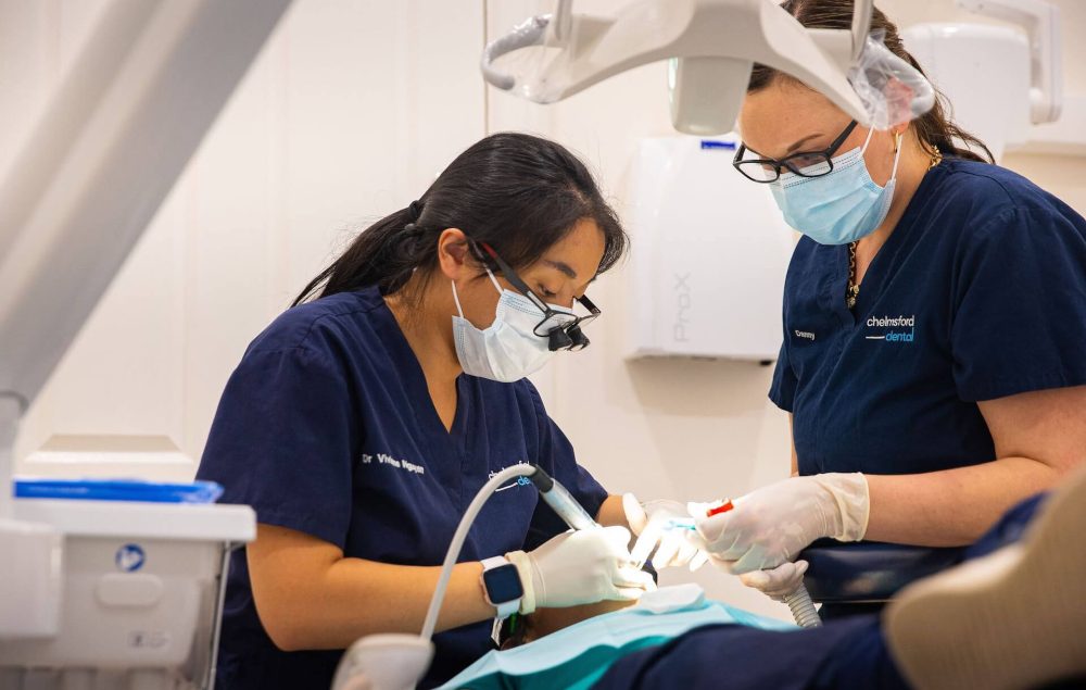 Dentist putting in a dental bridge
