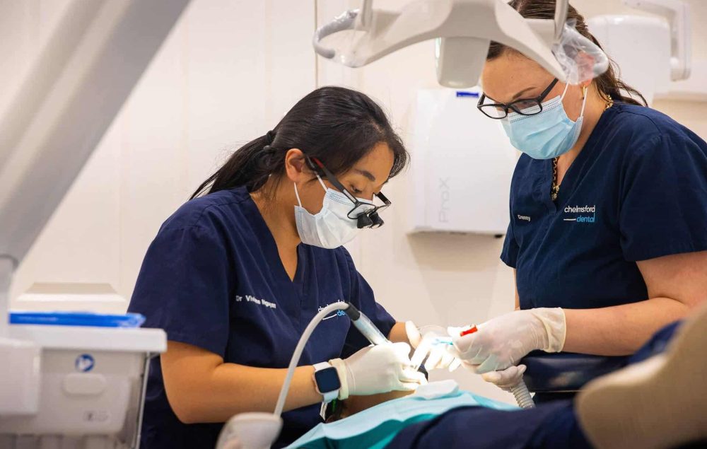Dentist putting in a dental bridge