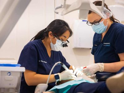 Dentist putting in a dental bridge
