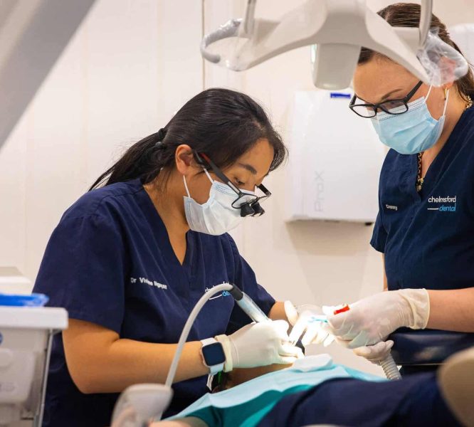 Dentist putting in a dental bridge
